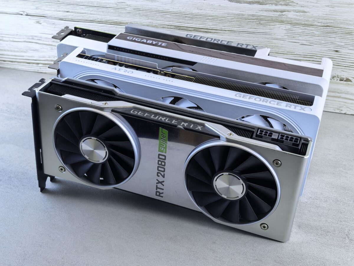 Three NVIDIA GeForce RTX graphics cards stacked on a surface, showcasing their sleek design and bran